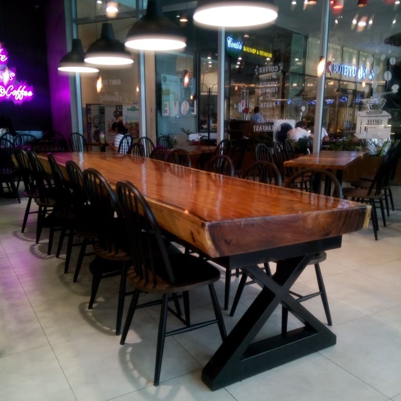 interiors of the Black Scoop Cafe - long tables , lighting, wall art/design